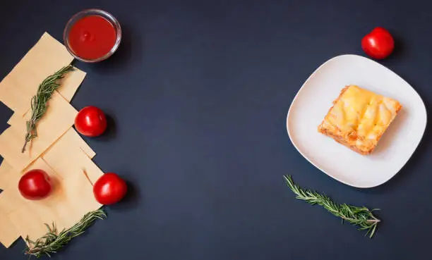 Couple cooking lasagna together